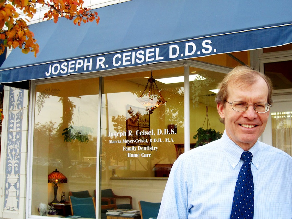 Dr. Ceisel in front of the office